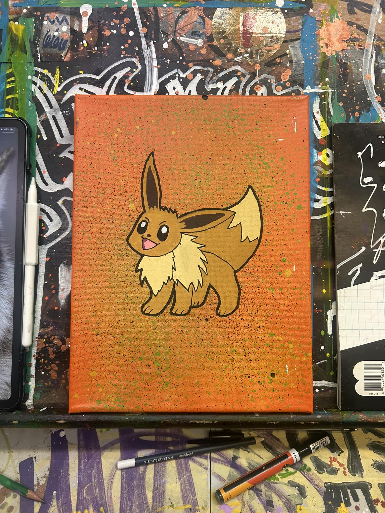 Eevee painting on orange speckled background