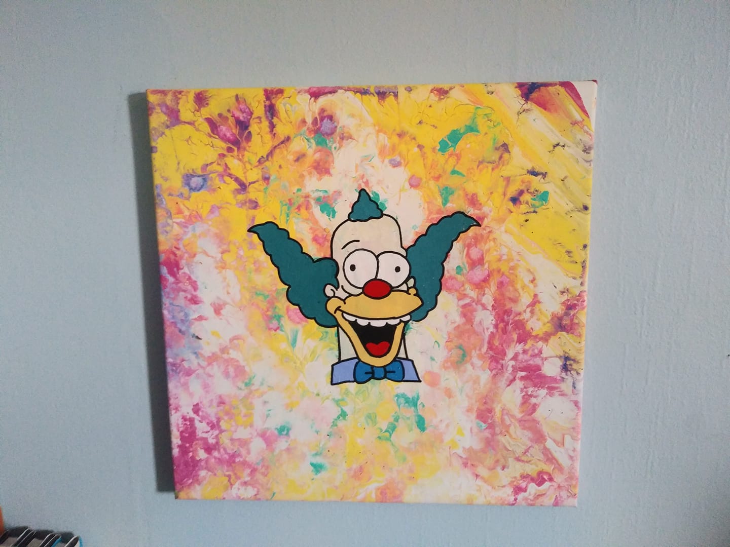 Krusty the Clown painting on colorful pour paint background