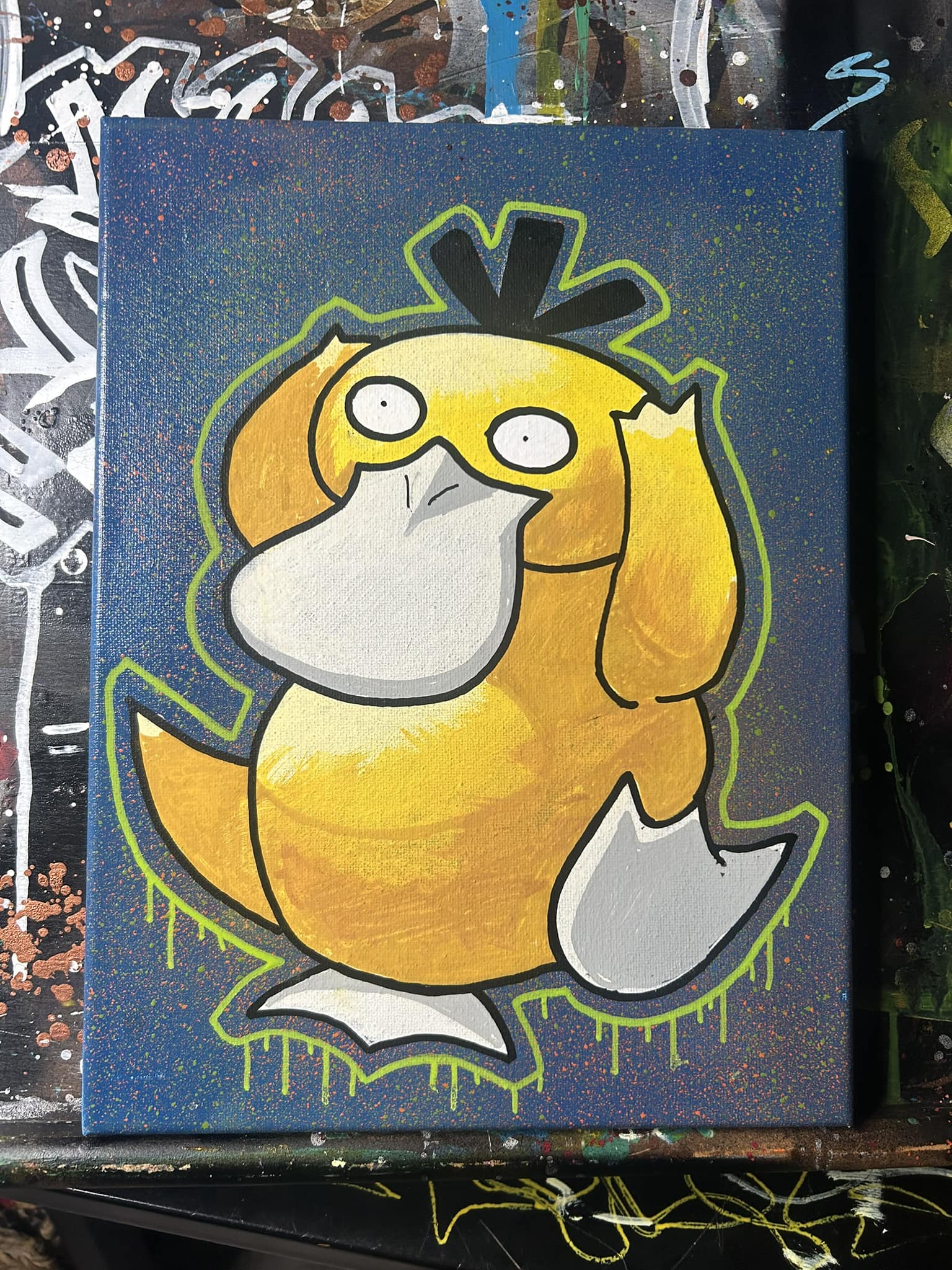 Psyduck painting on blue speckled background