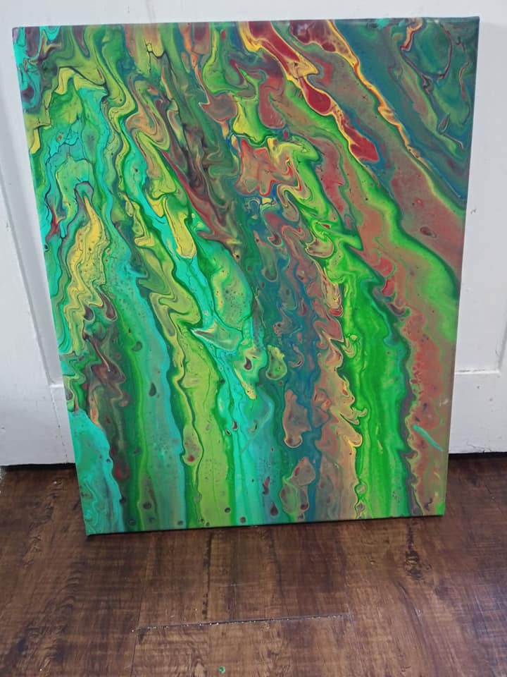 Green and red abstract pour painting